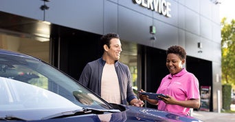 Service center representative talking to a customer.