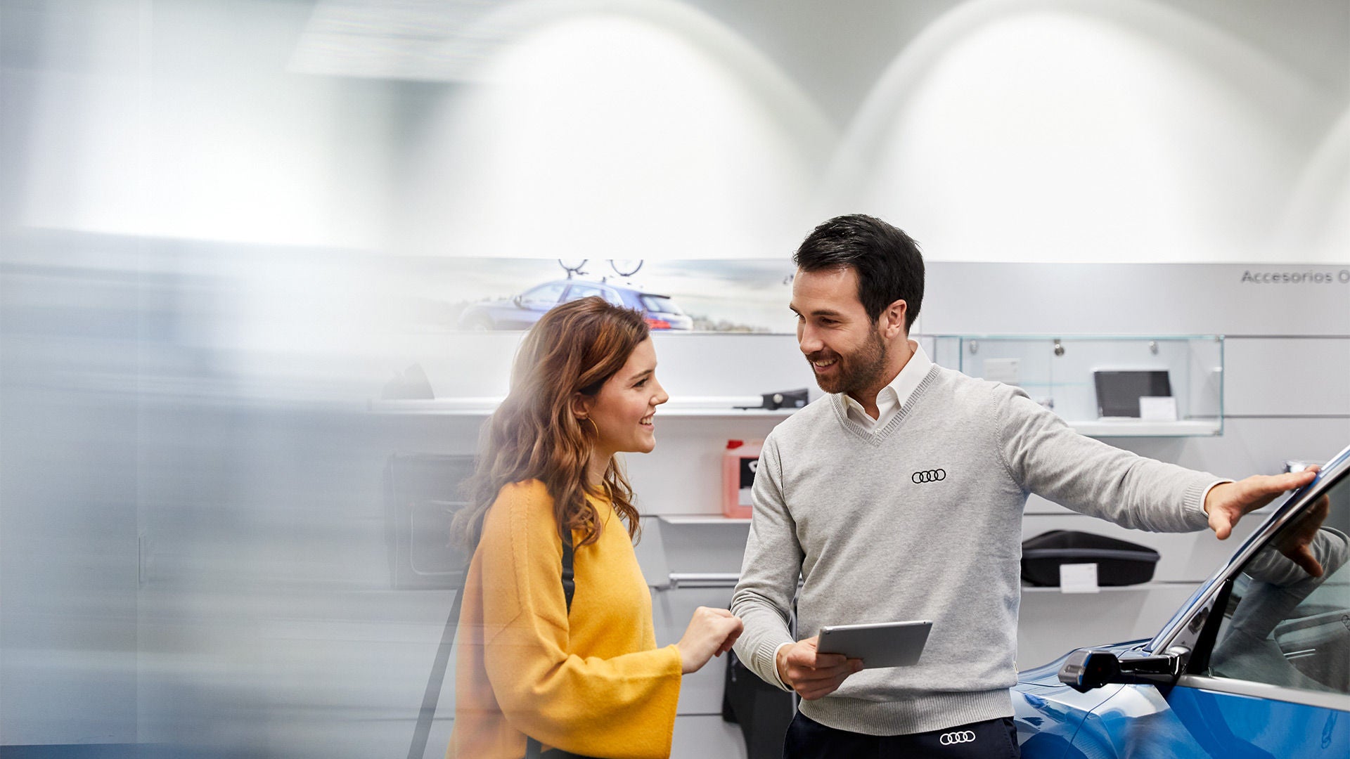 Audi sales technician working with a customer.