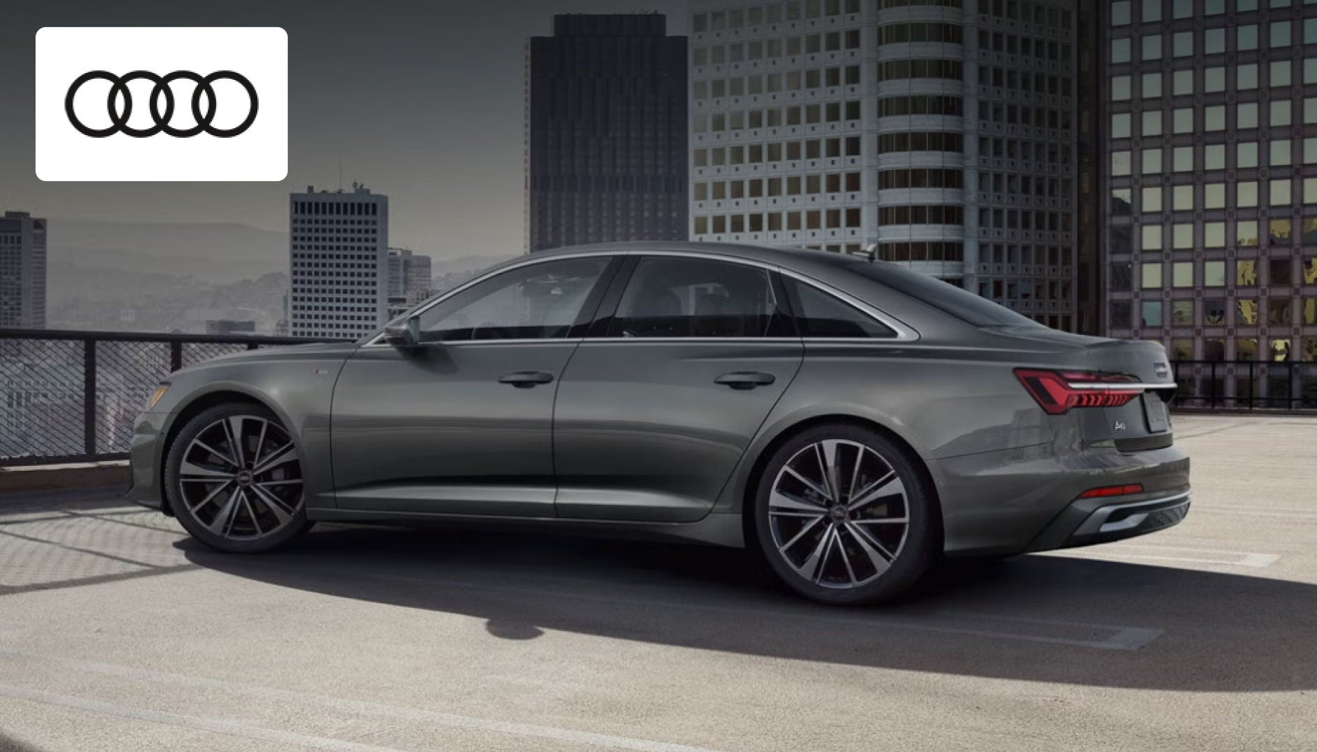 Audi A6 luxury sedan parked outside Audi Dayton, showcasing its sleek executive design
