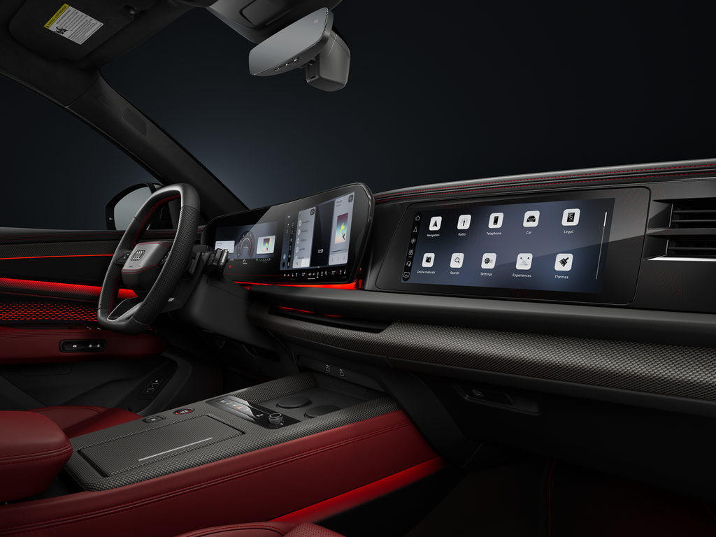View of the cockpit and digital displays of the Audi SQ7 SUV from the passenger side.