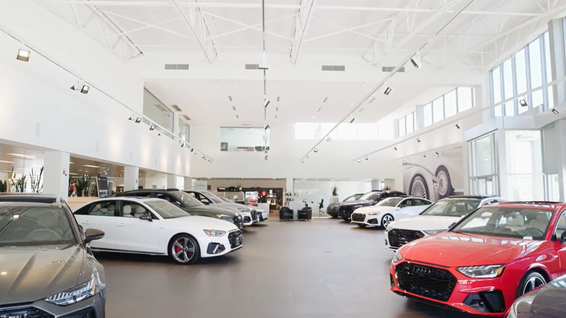 View of cars inside an Audi dealership.