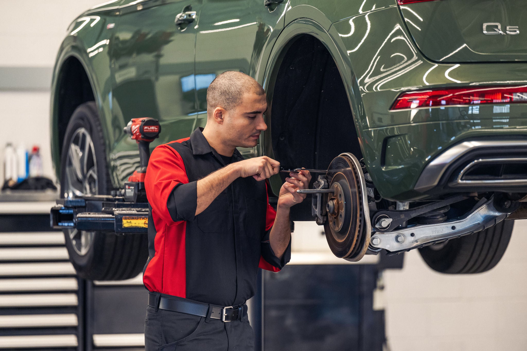 Service technician working on an Audi SUV