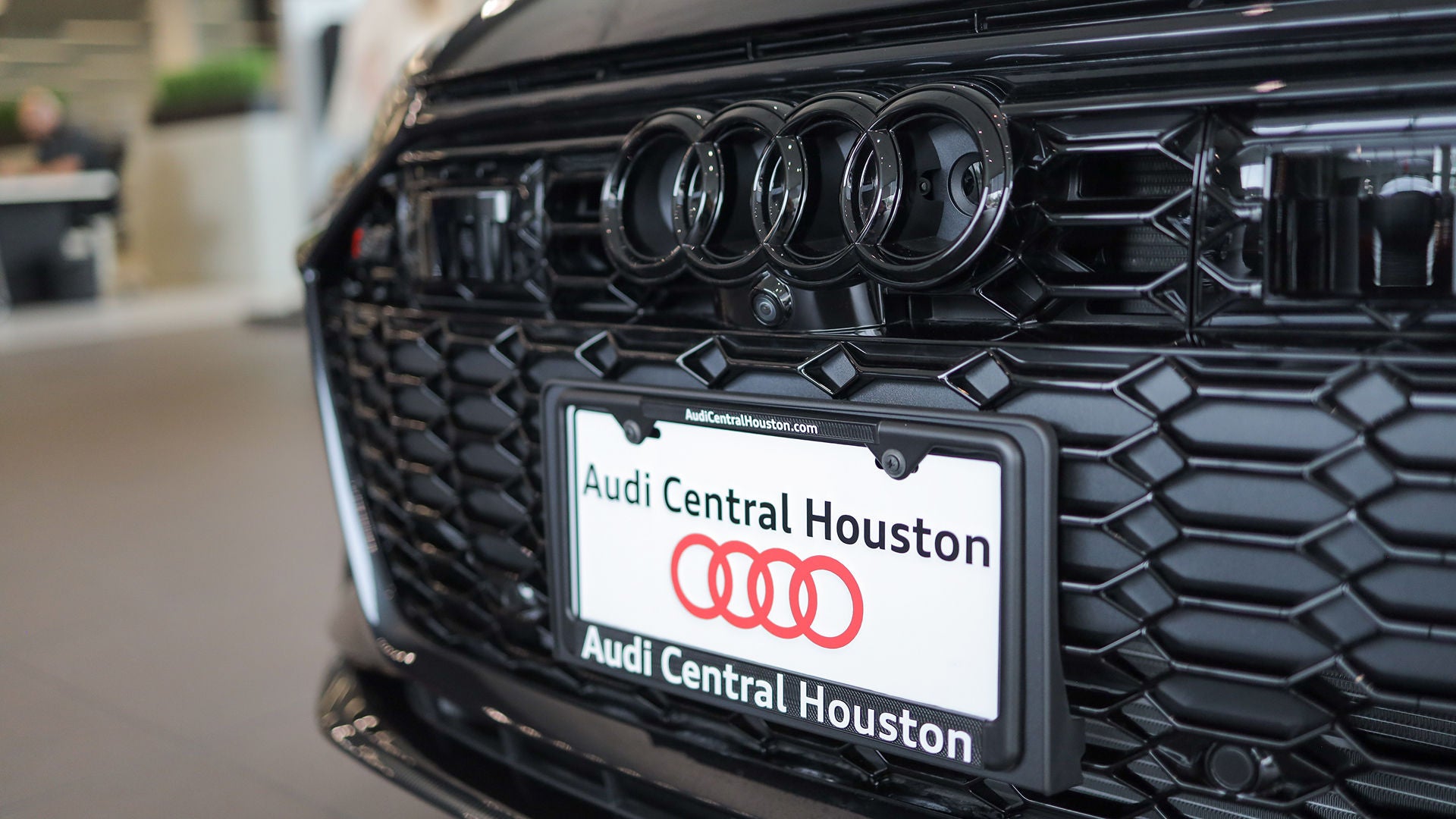 Audi employee polishing an Audi SUV