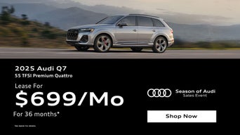 Three quarter view of an Audi Q7 parked.