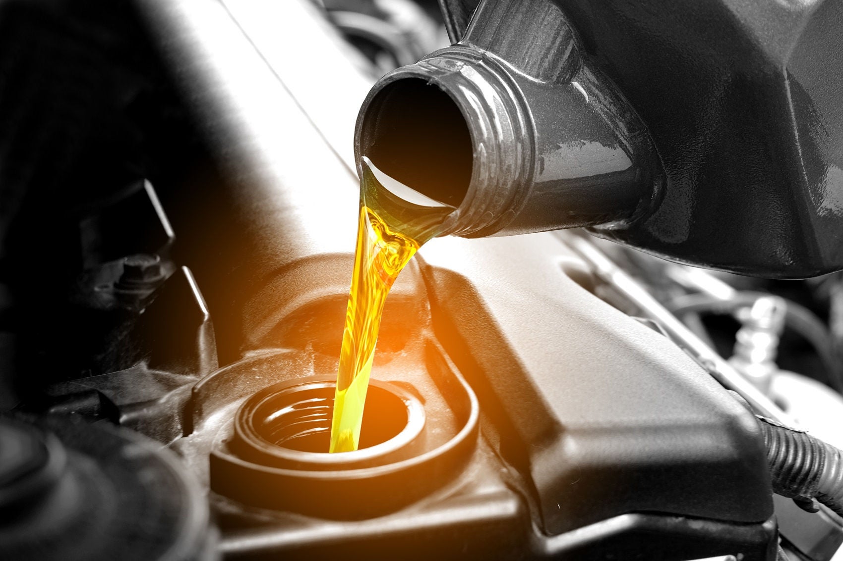 oil being poured into a filter.