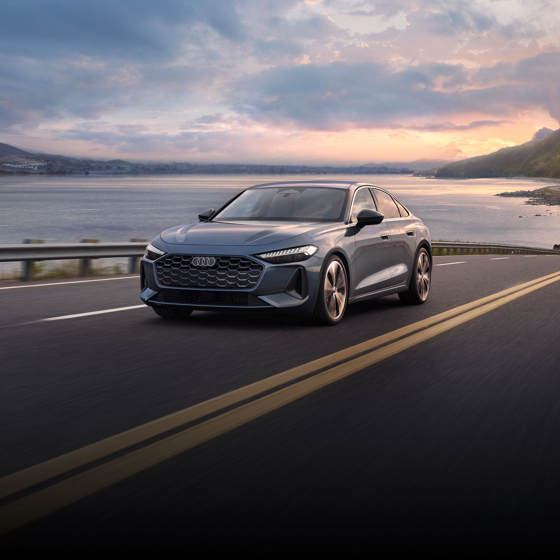 Three-quarter front-view of the all-new Audi A5 accelerating.