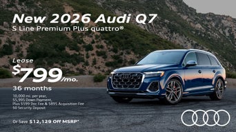 Side view of an Audi Q7 driving.