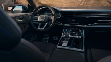 Interior view of the Audi RS Q8 showing the middle console and driver's cockpit.