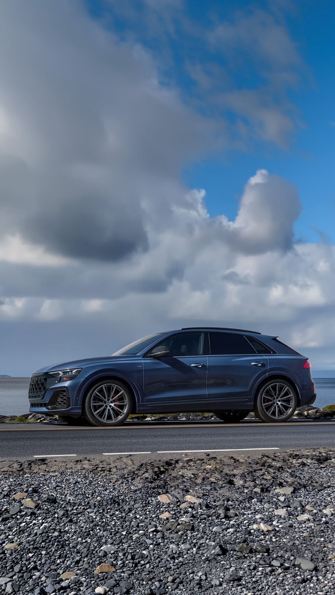 Audi Q8 driving through mountain road in Maine
