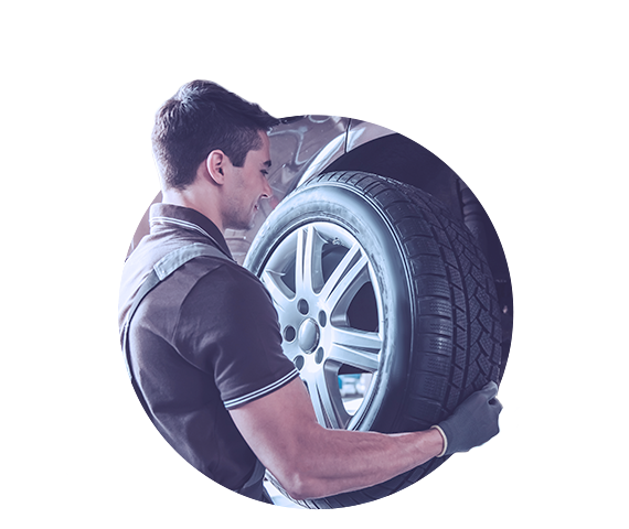 Service technician servicing vehicle. 