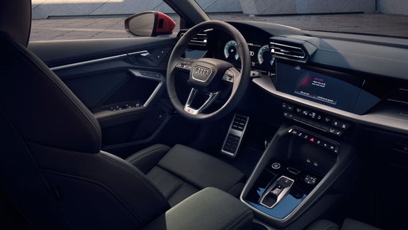 Interior cabin photo of dash and driver seat in a 2026 Audi A3