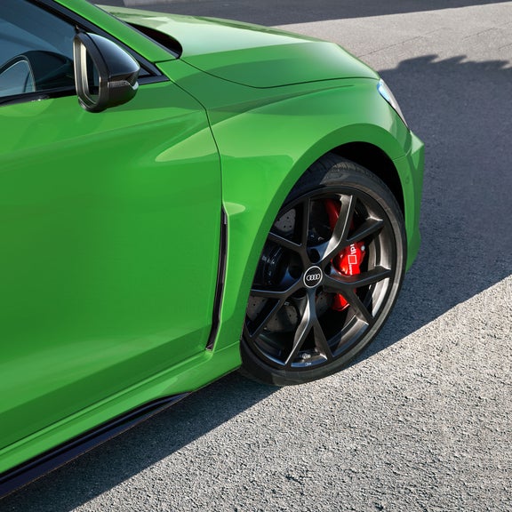 The Audi RS 3 exterior features a wide stance, signature flared fenders and large, aggressive front air vents.