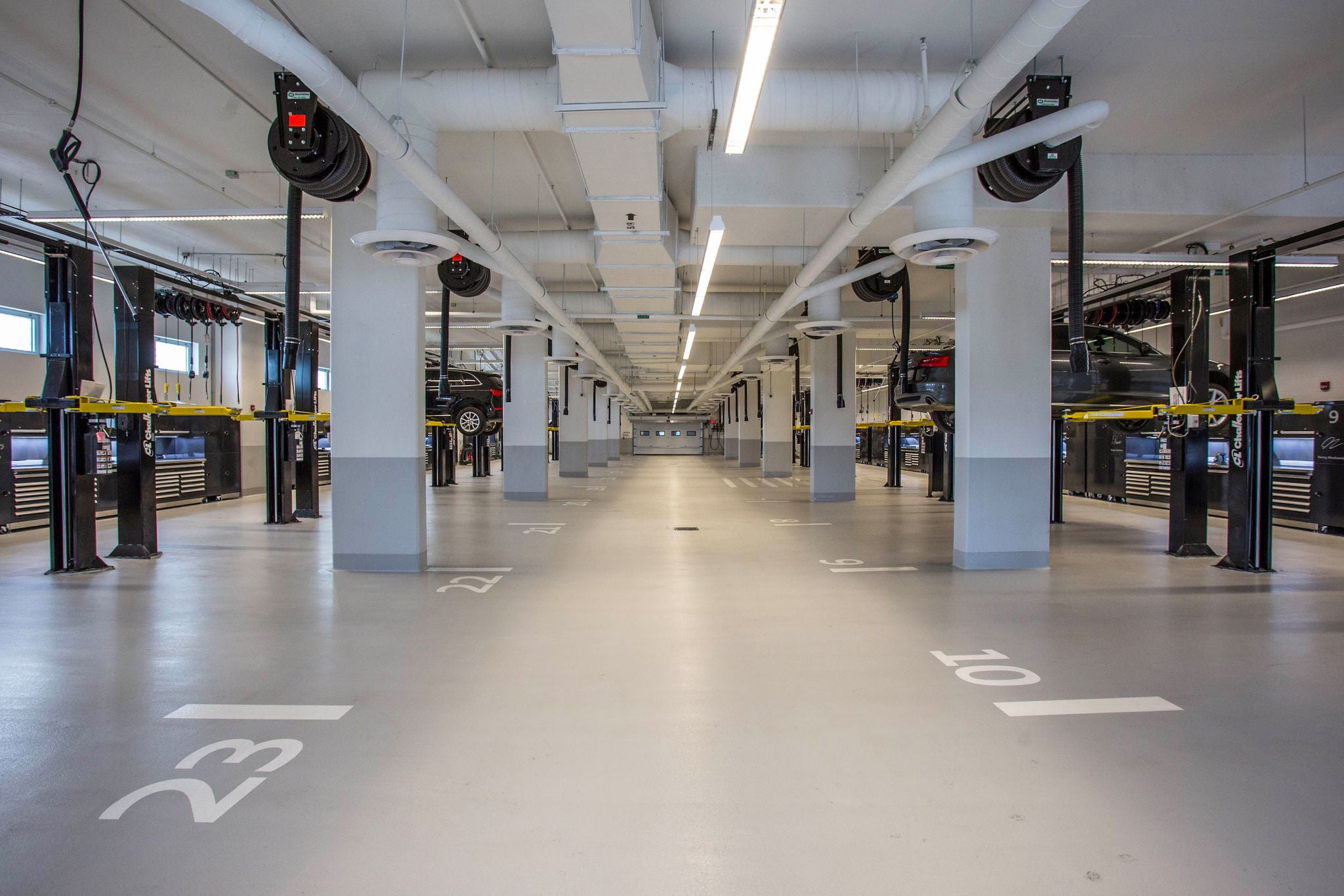 Audi Midtown Toronto service bay with vehicle hoist used for vehicle maintenance and repairs