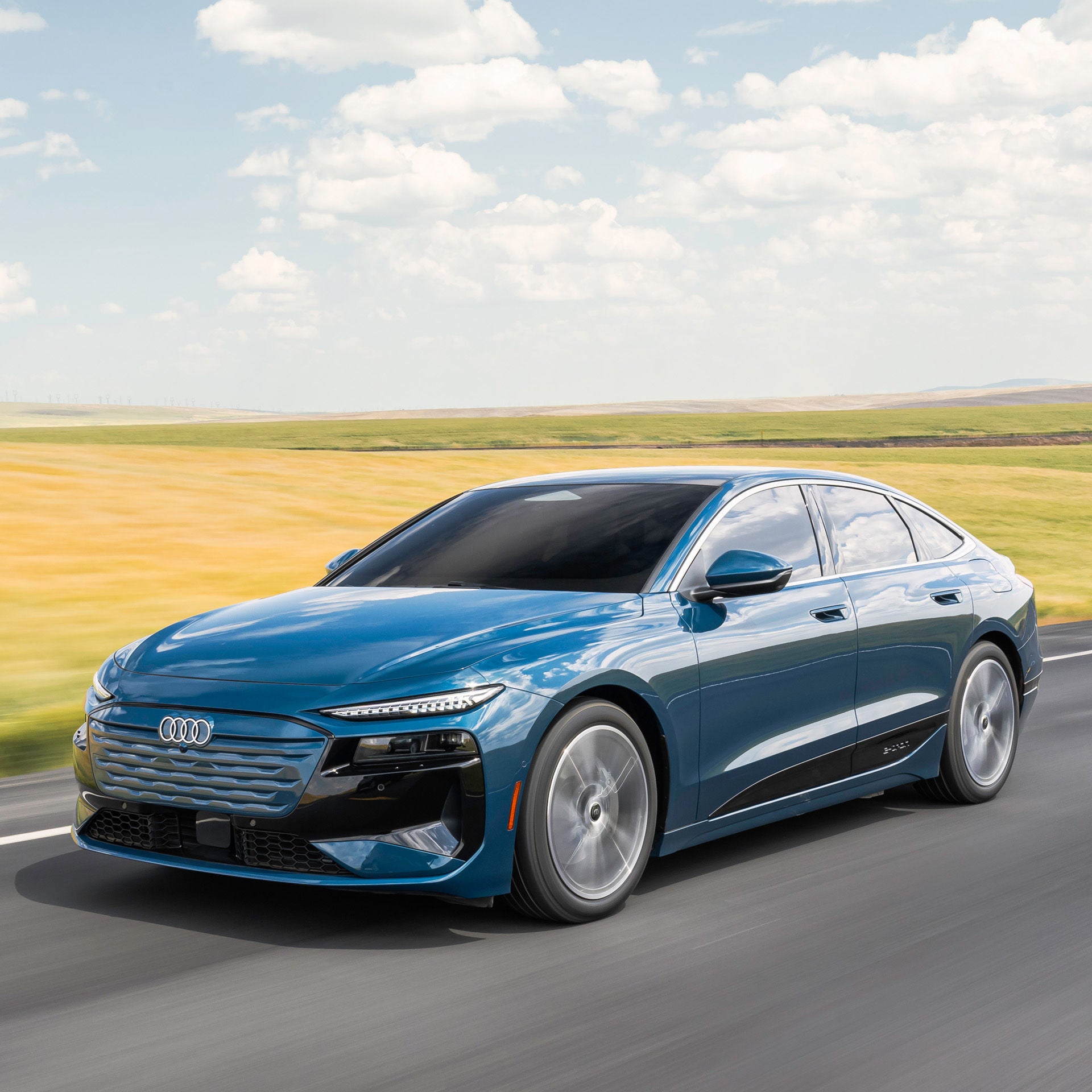 Right profile view of an Audi A6SB etron accelerating.