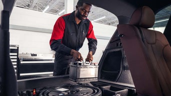Service Technician installing a battery.