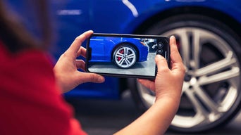 Service technician taking a photo of the tire