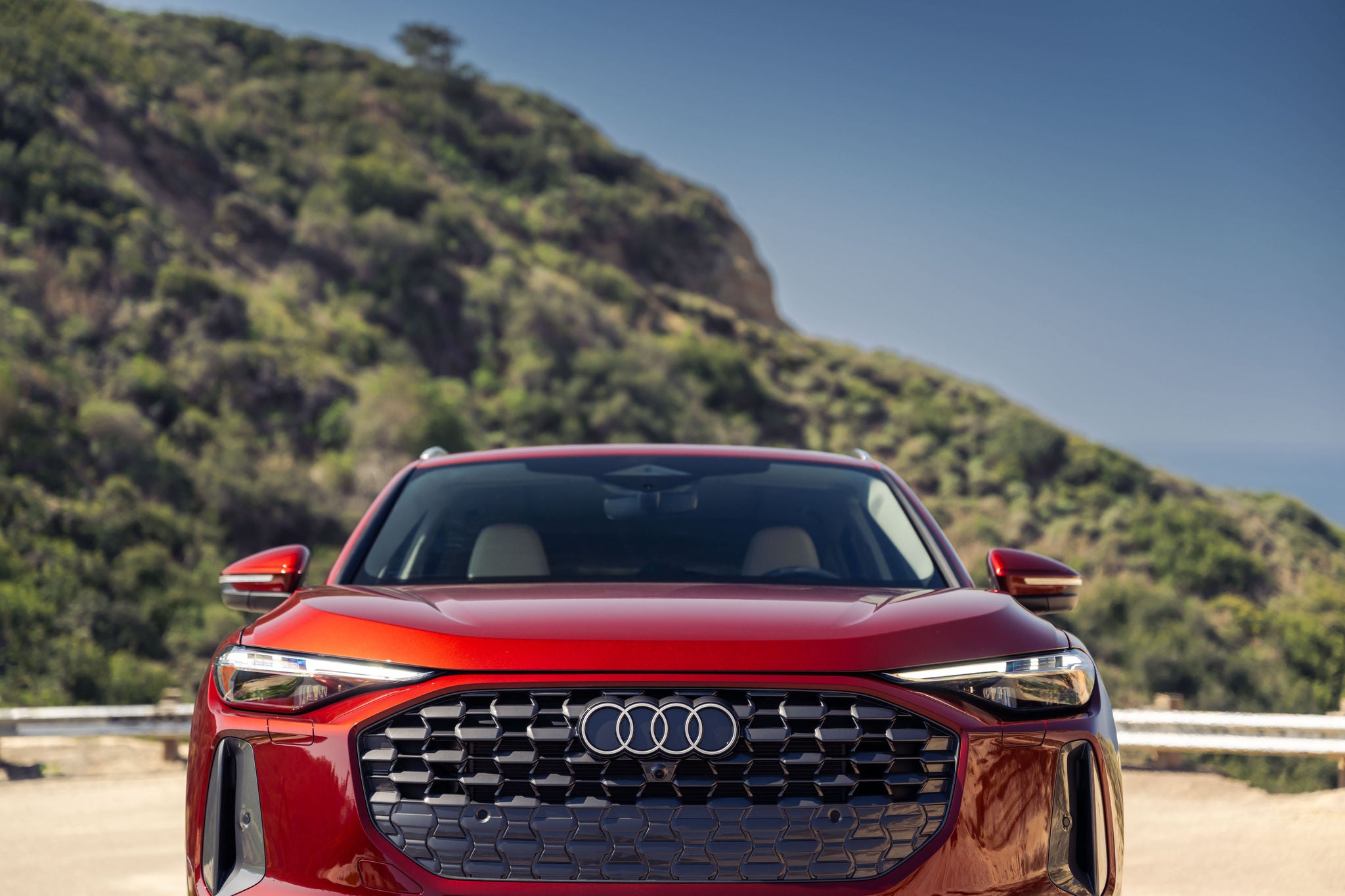 Front profile view of an Audi Q5 parked.