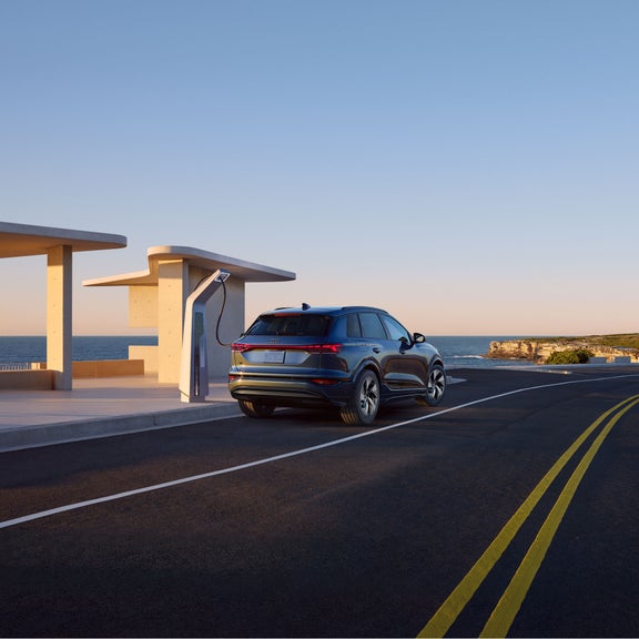 Rear view of the Audi Q6 e-tron charging.
