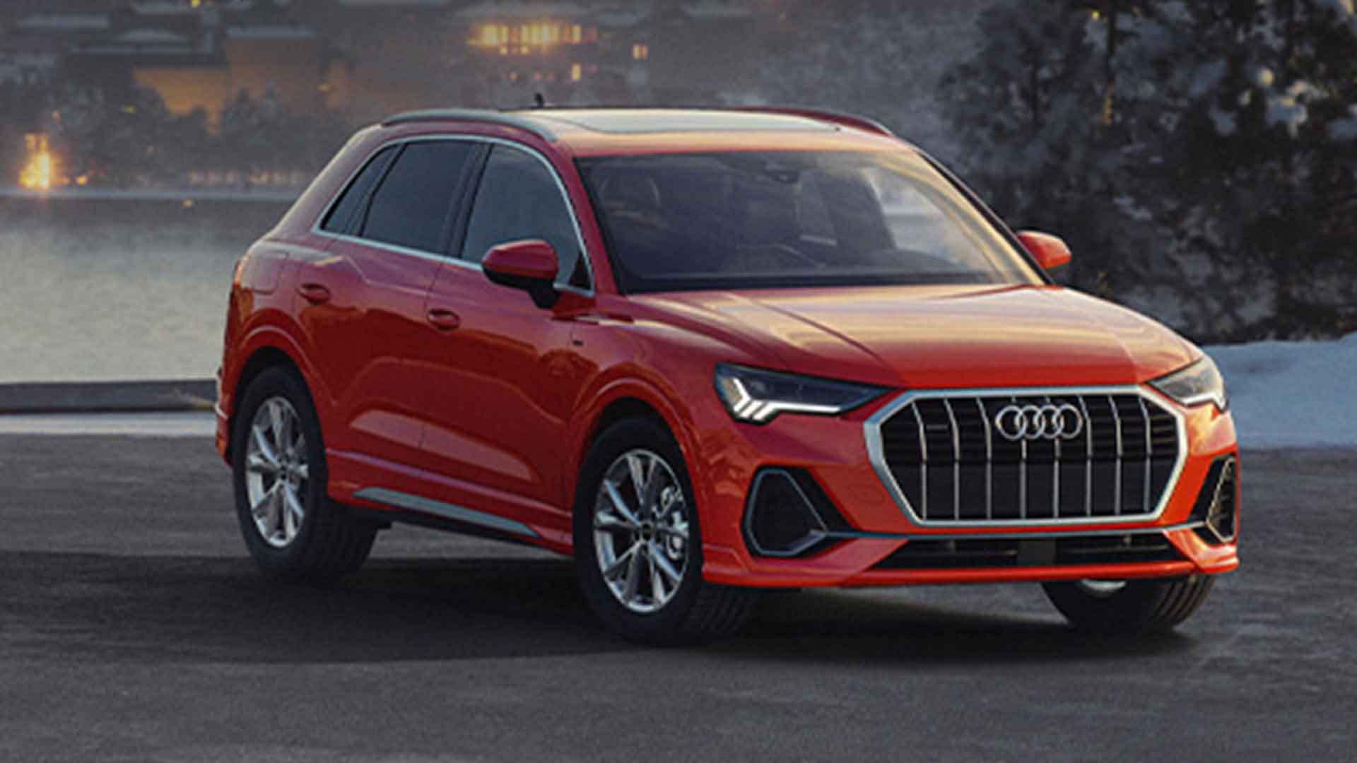 Side view of an Audi Q5 Hybrid driving.