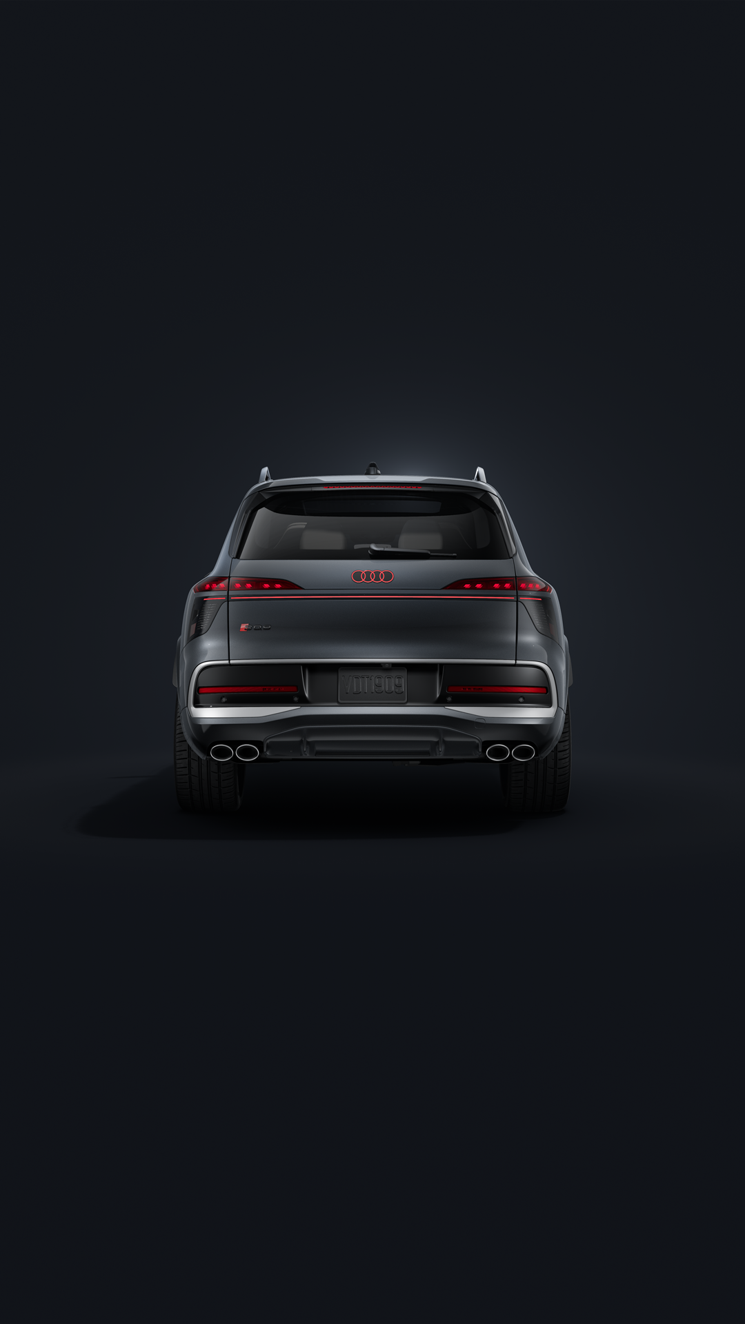 The Audi SQ9 SUV, viewed from the front at an angle against a dark background.