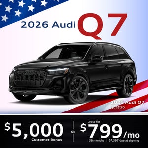 Side view of an Audi Q7 driving.