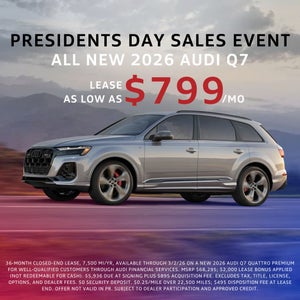 Side view of an Audi vehicle driving.