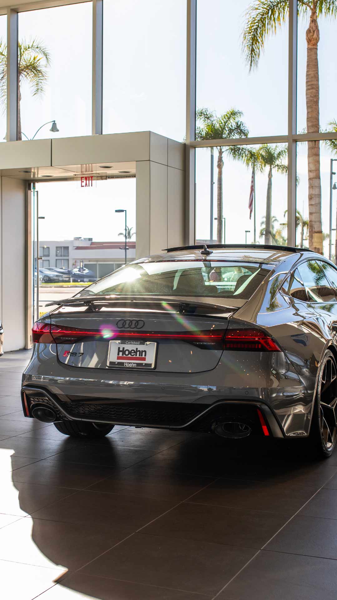 Audi Sale Specialist walking through the showroom with a couple.