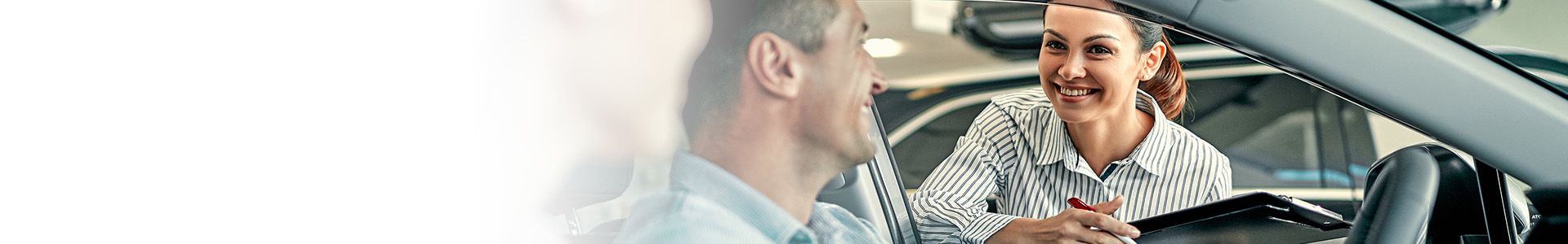 Three front profile Audi's accelerating with a sunset in the background.