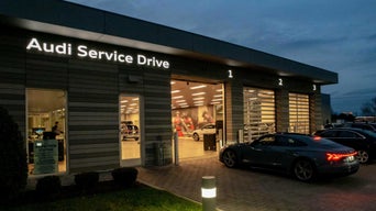 Exterior view of an Audi Service Drive center.