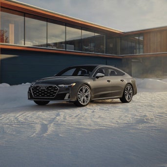 Audi A7 equipped with winter tires parked on a snow-covered road