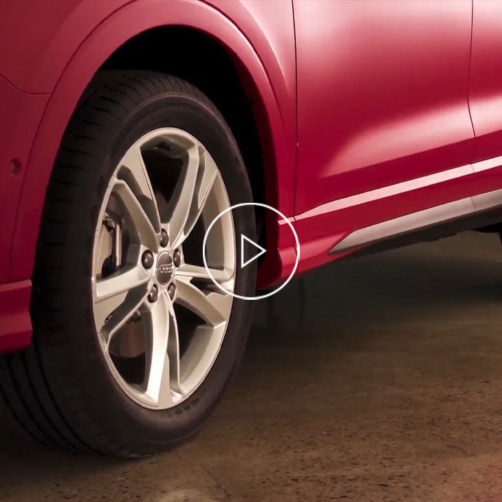  Close-up on the tire of an Audi vehicle in motion. 