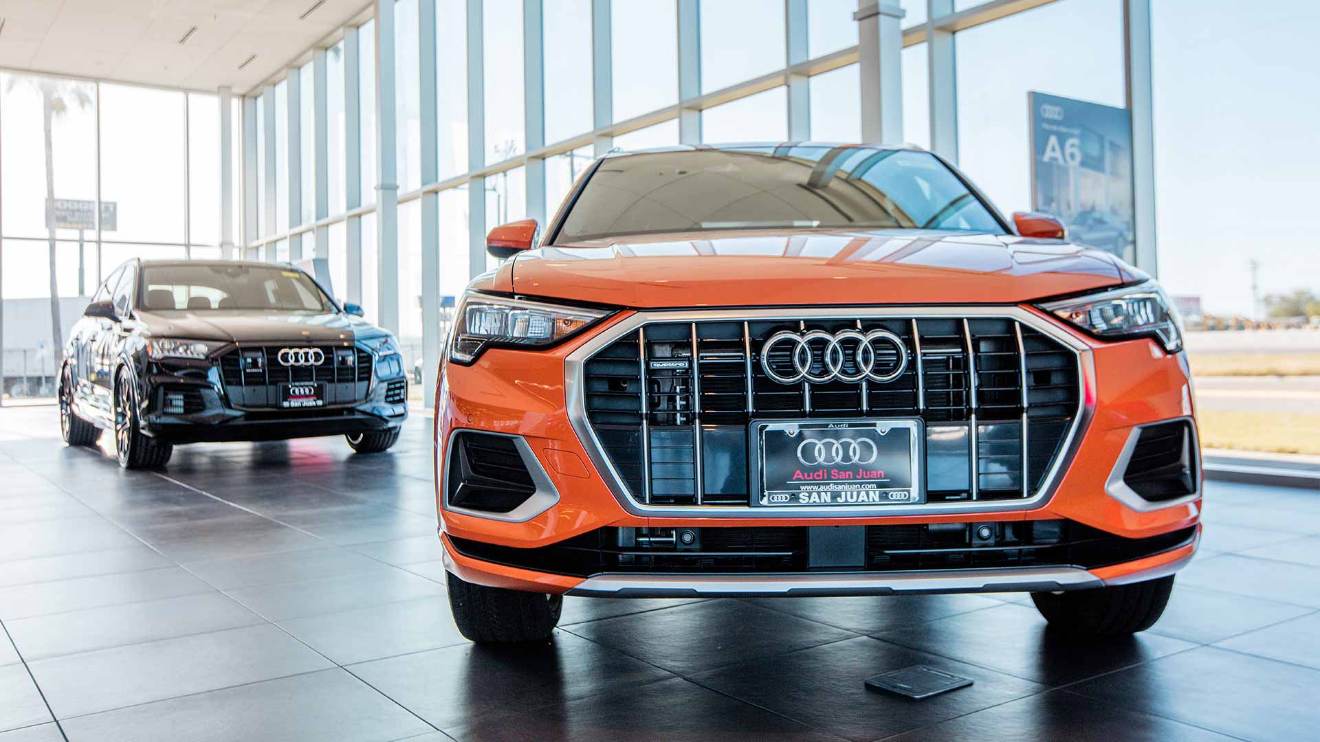 Front view of an Audi vehicle parked in the Audi San Juan showroom