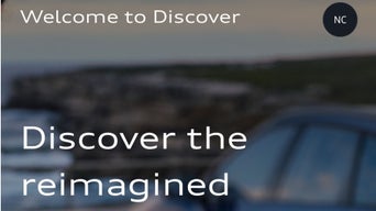 Close-up of the myAudi Discover tab interface on the myAudi app.