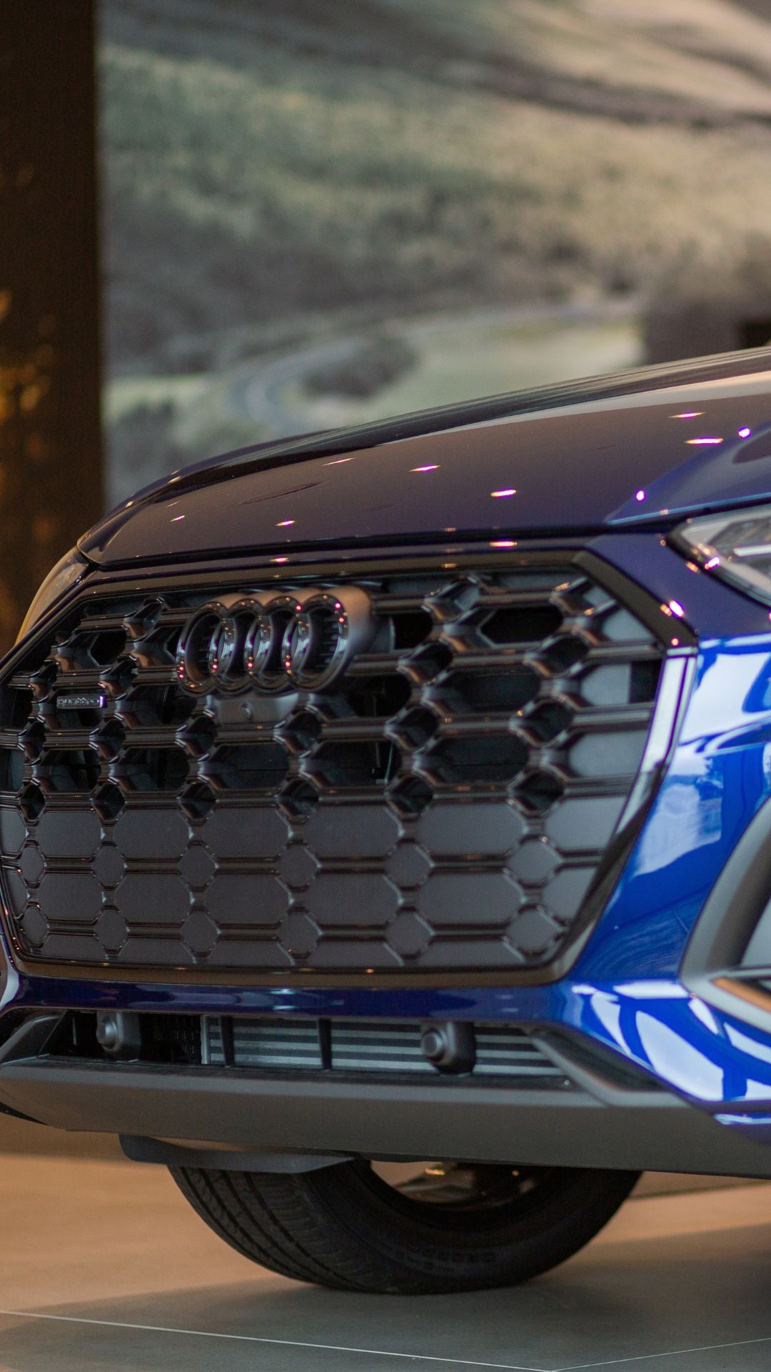 Three quarter view of an Audi parked.