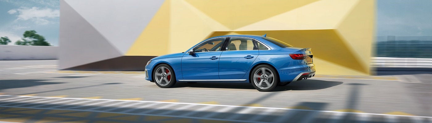 Side view of Audi S4 driving on highway