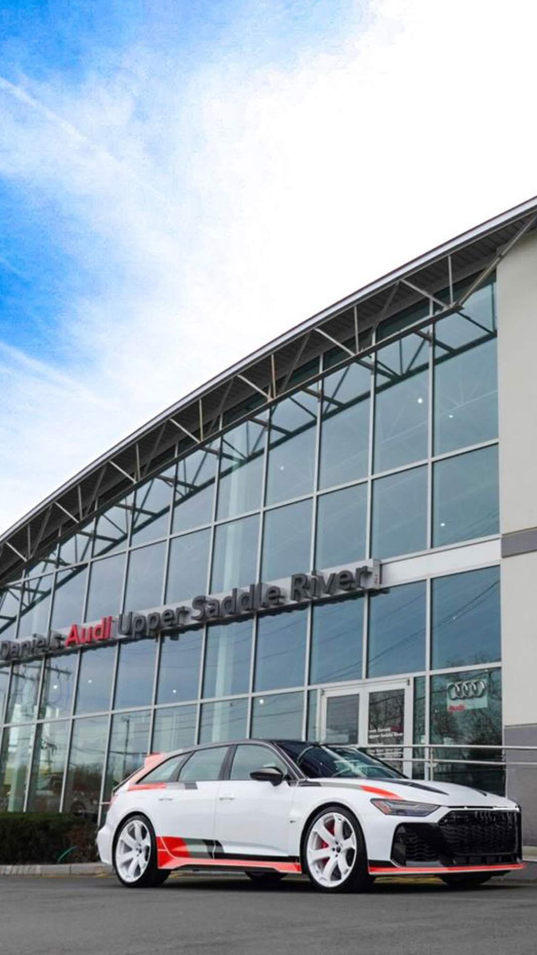 Left side profile view of an Audi S6 parked.