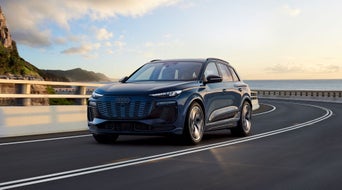 Profile view of Audi vehicle. 