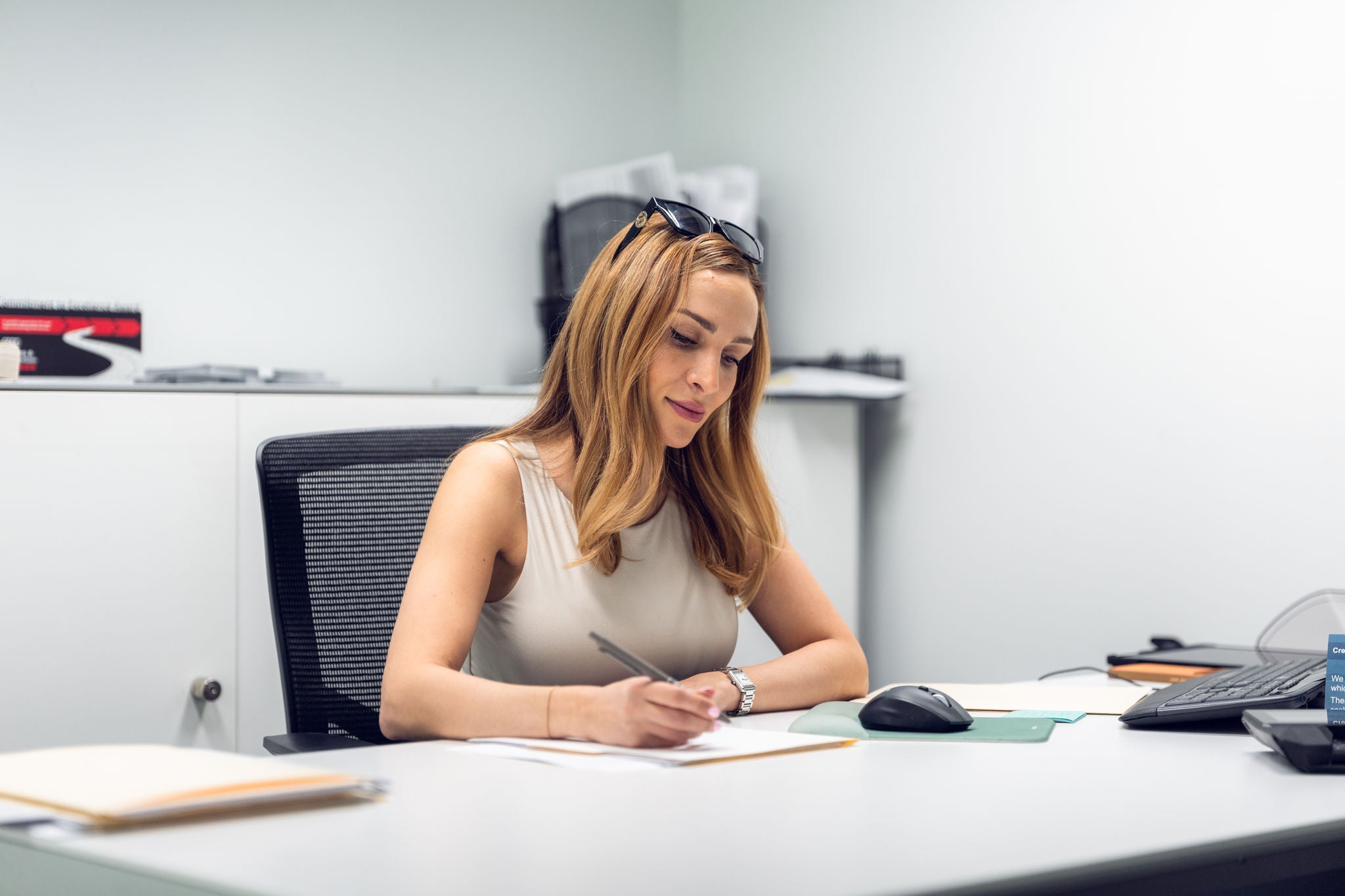 Audi Sale Specialist at their desk.