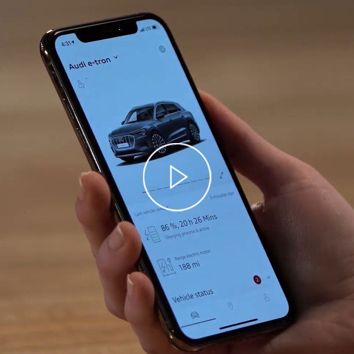  Close-up on a cell phone displaying the myAudi app. 