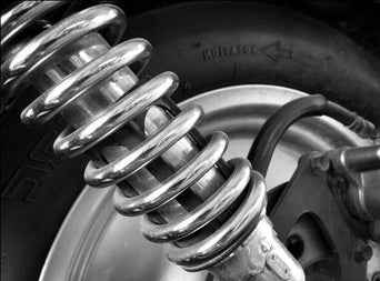 Service technician serving vehicle.