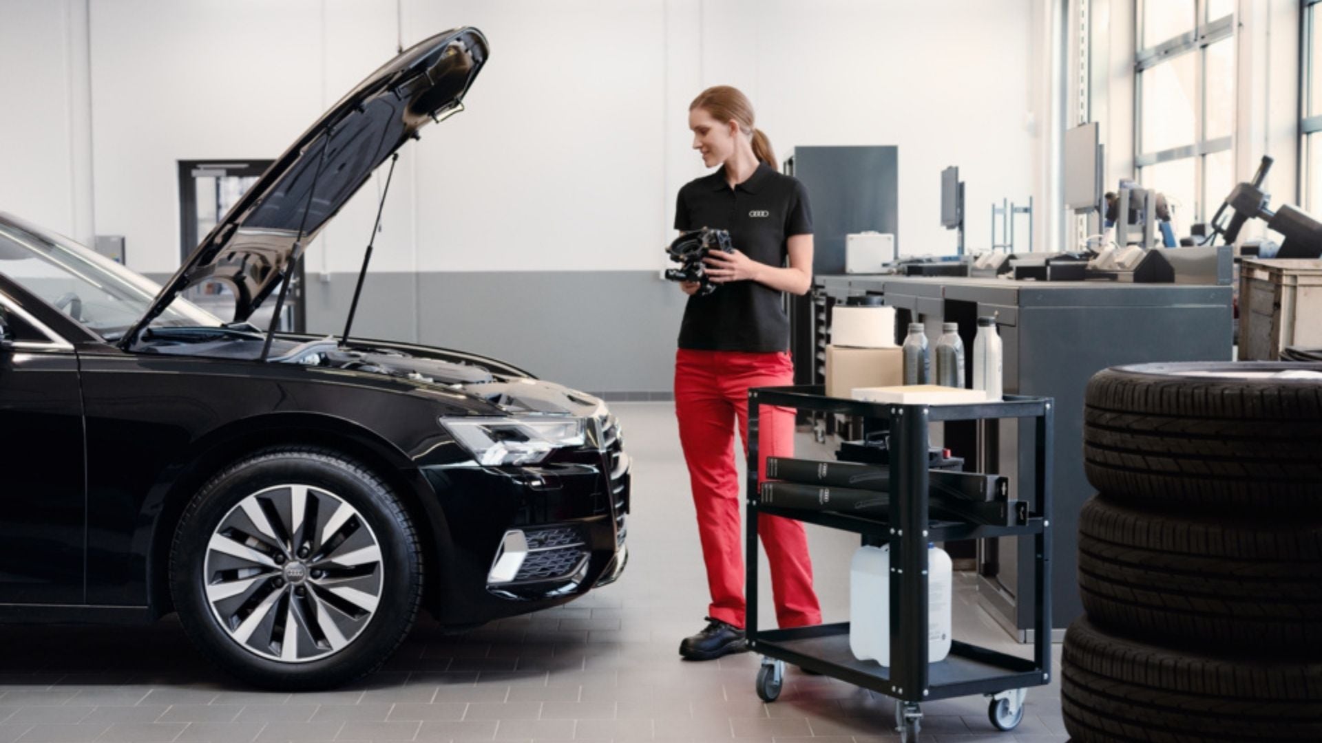 image of audi employee checking car