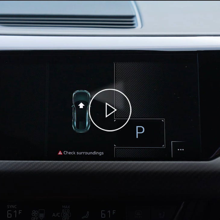 Close up on the Audi MMI displaying the park assist plus feature. 