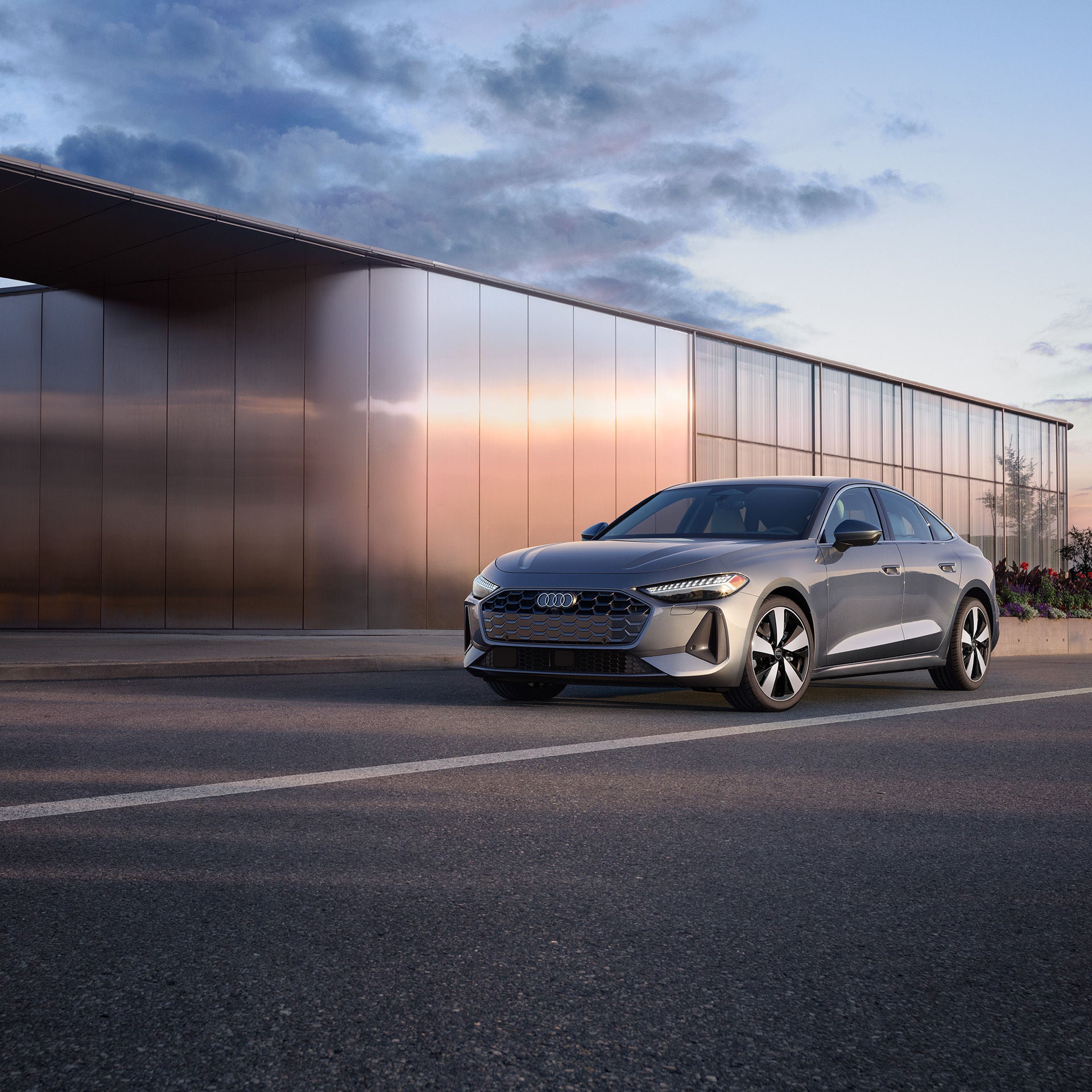 Left profile view of an Audi Q7 accelerating.
