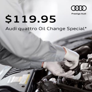 Audi technician installing an oil filter