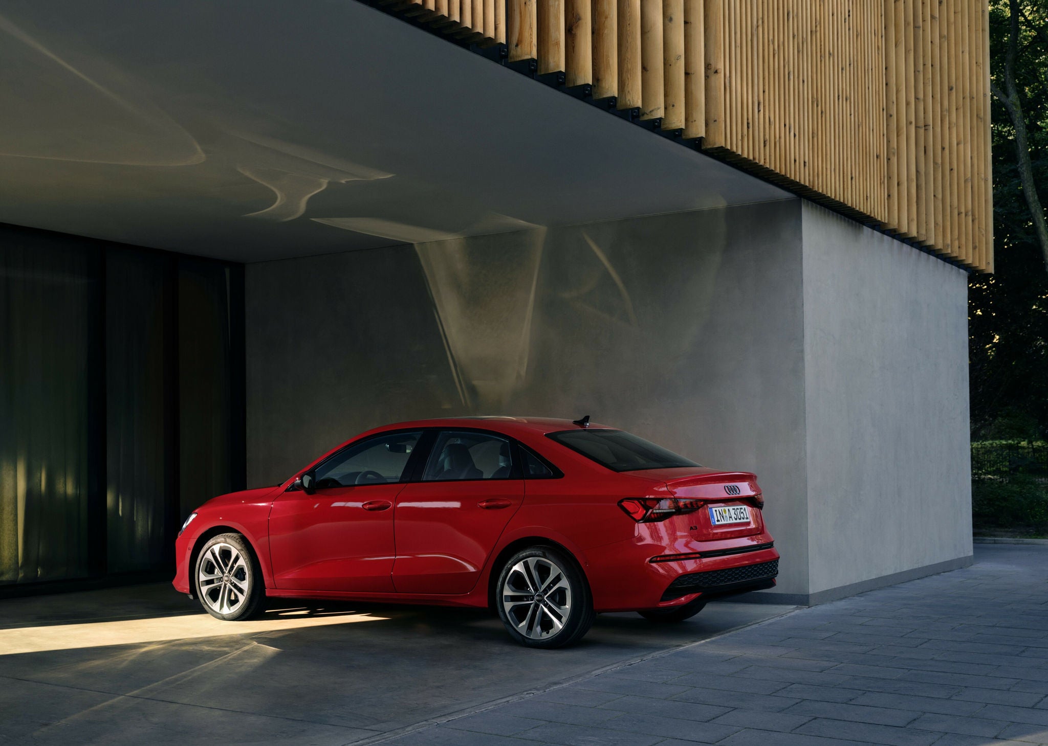 2026 Audi A3 sedan parked, Progressive Red.