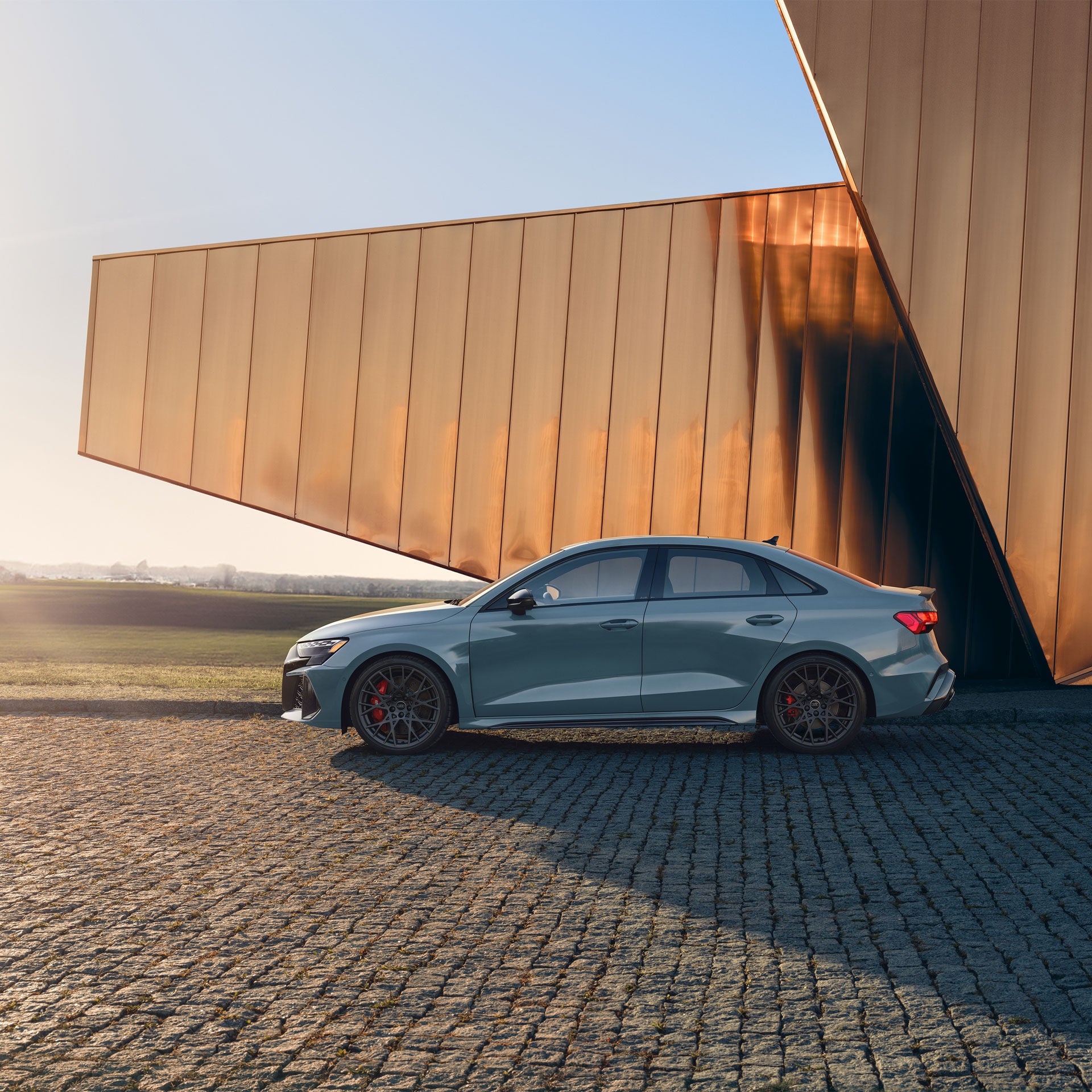 Side view of the Audi RS 3 parked.