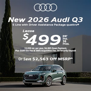 Side view of an Audi Q3 parked.