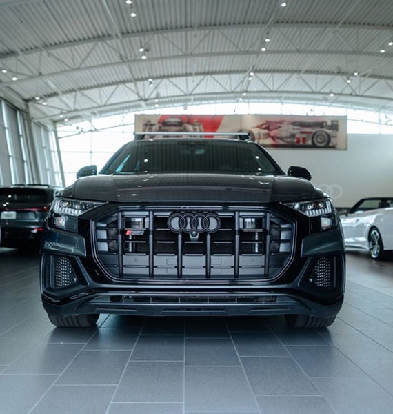Rear profile view of an Audi Q5 parked.