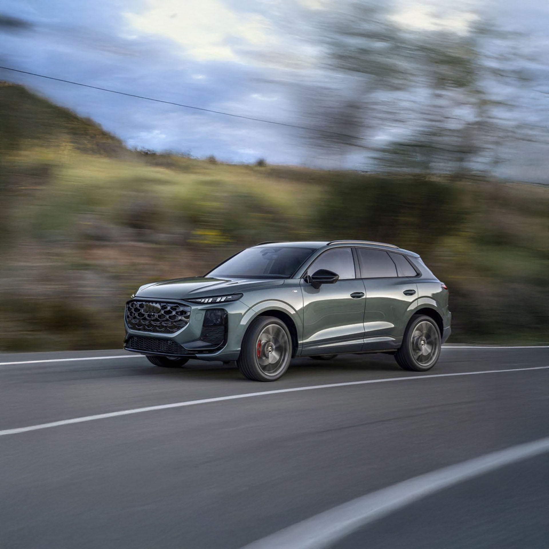 Front view of an Audi accelerating.