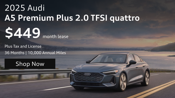 2025 Audi A5 Premium Plus sedan driving along a coastal road with lease offer displayed